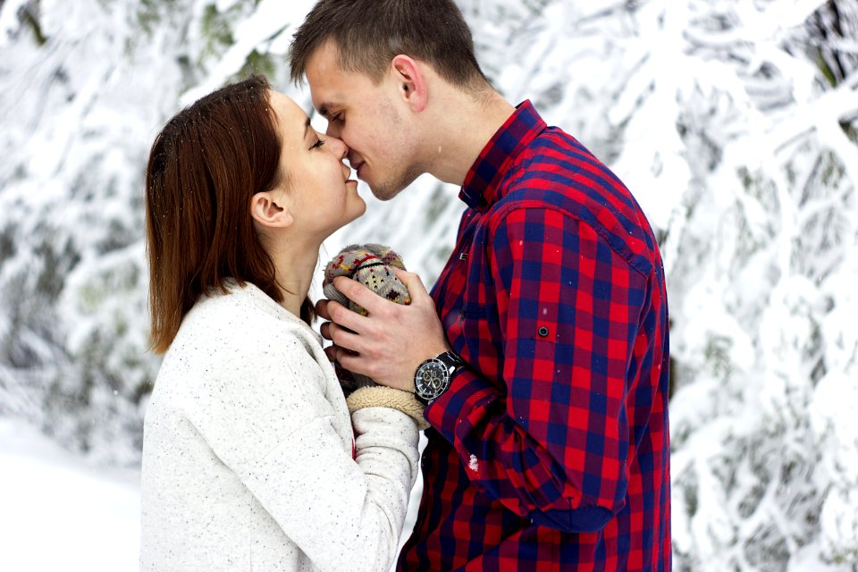 Young Couple Kissing In Winter