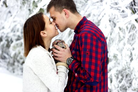 Young Couple Kissing In Winter