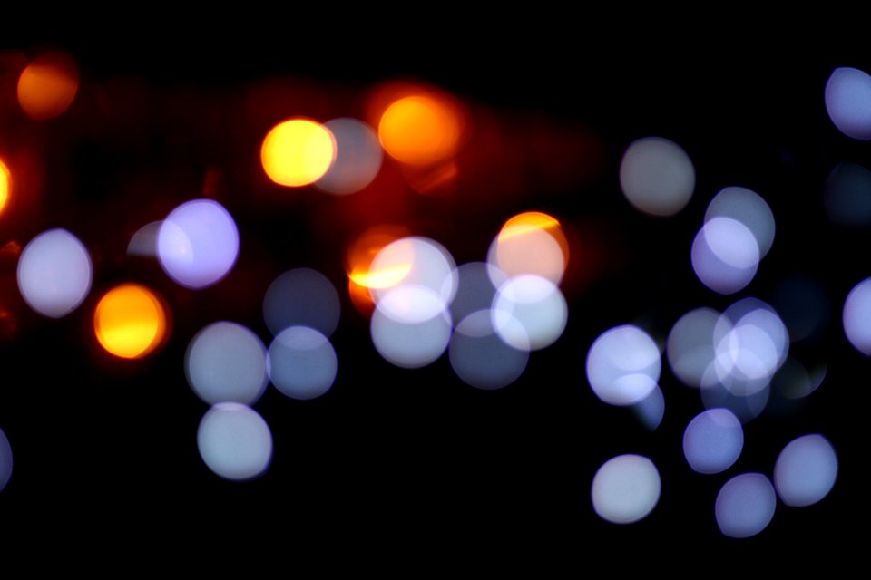 Defocused Image Of Illuminated Lights At Night