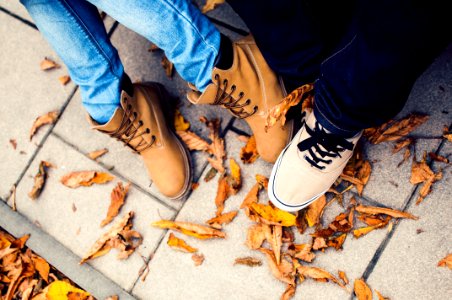 Two Pairs Of Feet In Shoes photo