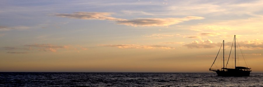 Sailboat On Water At Sunset photo