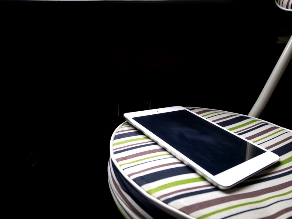 Apple IPad On Striped Chair