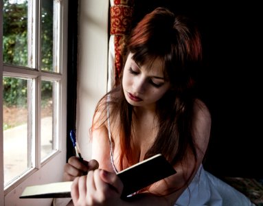Young Girl Writing photo