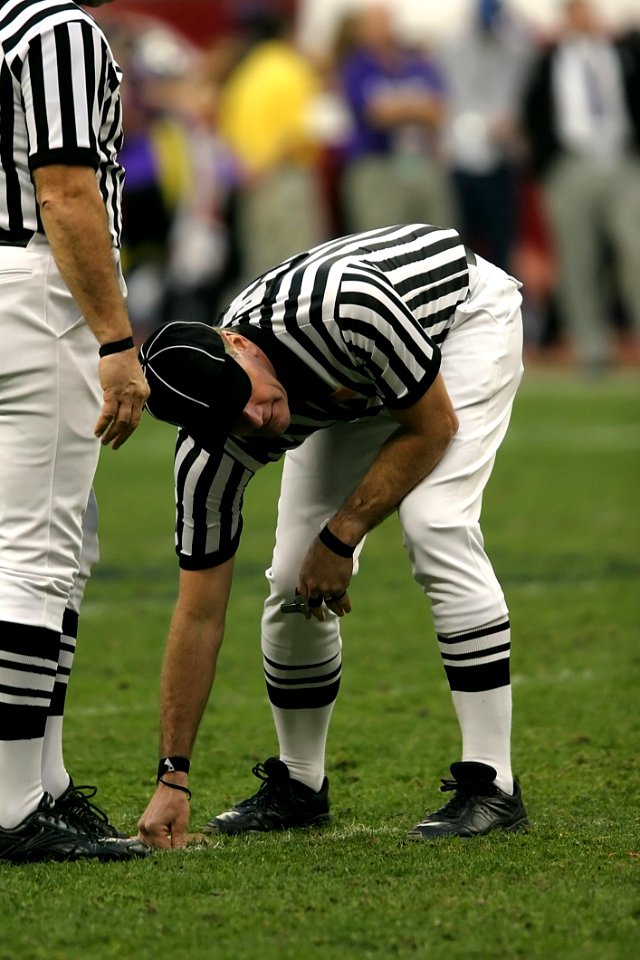 Person In Black And White Striped Uniform