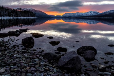 Cloud Reflecting On Lake At Sunset