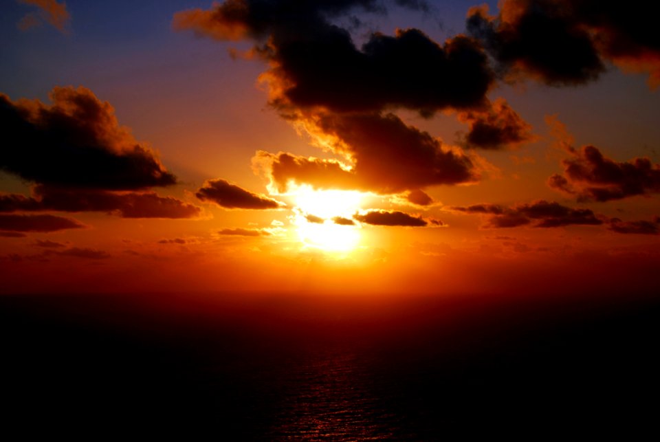 Sunset And Clouds Over Sea