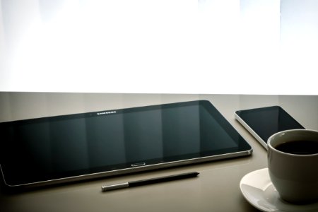 Tablet Smartphone And Cup Of Coffee photo