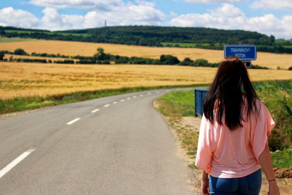 Back View Of Woman On Road Against Sky photo