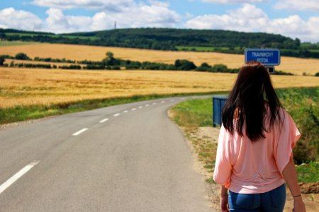 Back View Of Woman On Road Against Sky photo