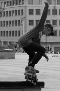 Boy Skateboarding Grayscale Photography photo