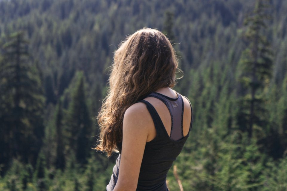 Female With Back Turned Overlooking Forest