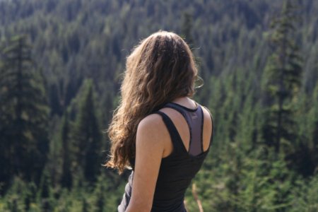 Female With Back Turned Overlooking Forest