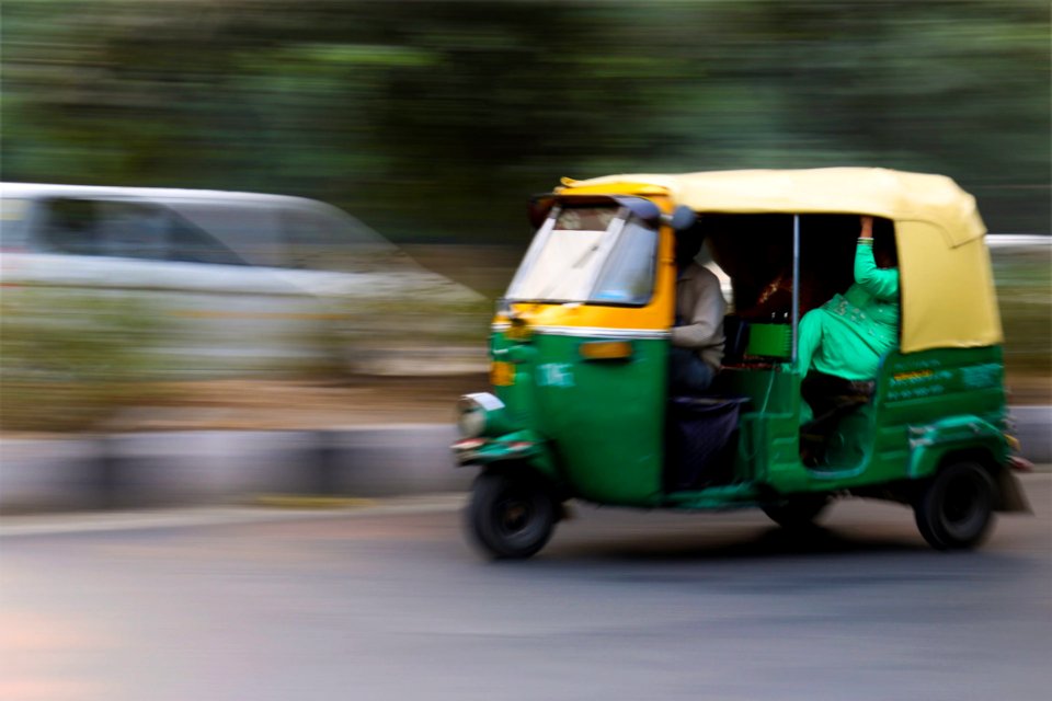 Green And Yellow 3 Wheeled Vehicle