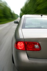 Silver Sedan On Gray Road