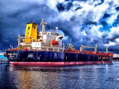 Blue And Grey Cargo Ship Navigating