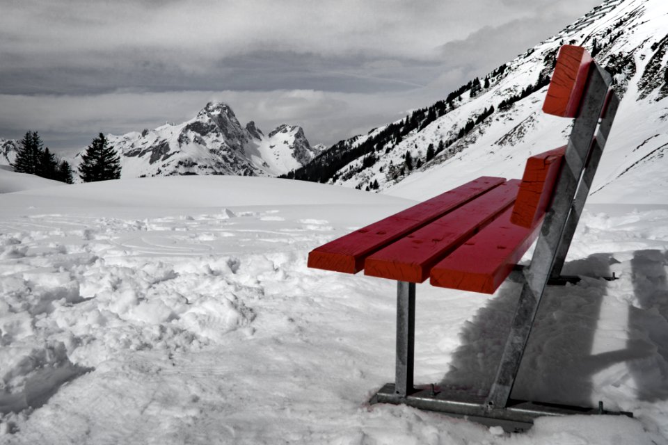 Grey And Brown Bench On Snow Near Mountain During Daytime