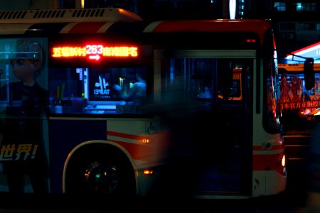 Silver City Bus On A City Street At Night photo