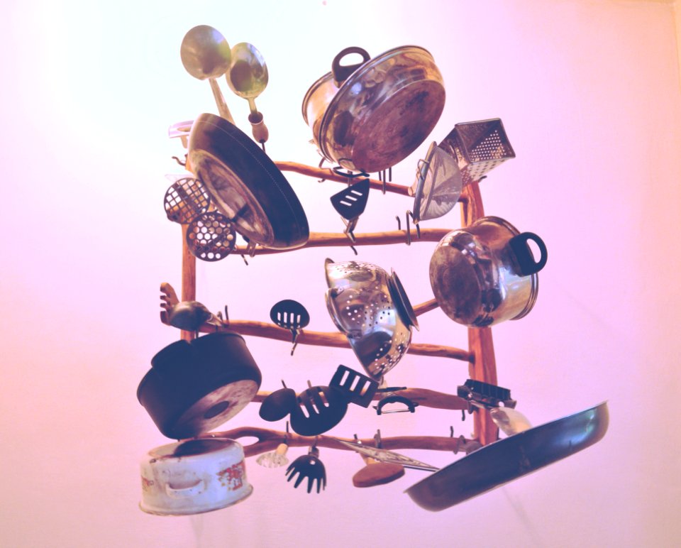 Kitchen Cookware Piled Up On Brown Wooden Rack