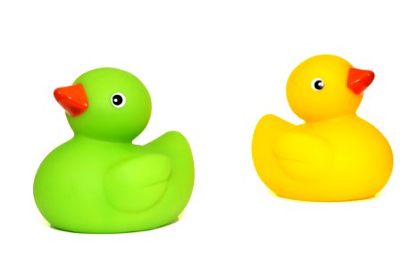 Yellow Duck Toy Beside Green Duck Toy photo