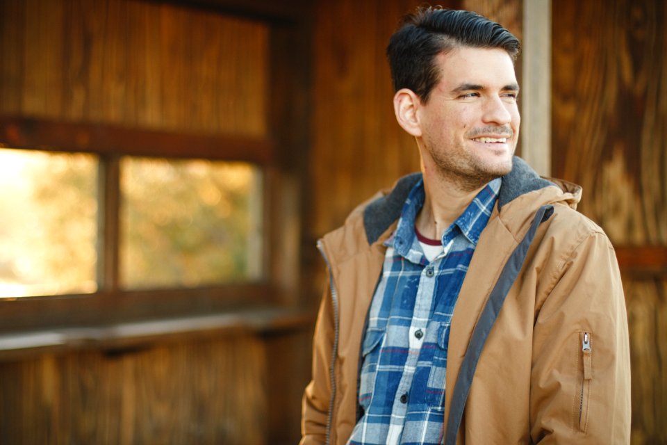 Young Man Looking Back With A Smile