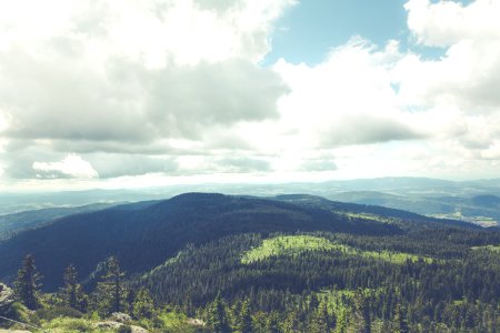 Green Hills Below White Cloudy Sky