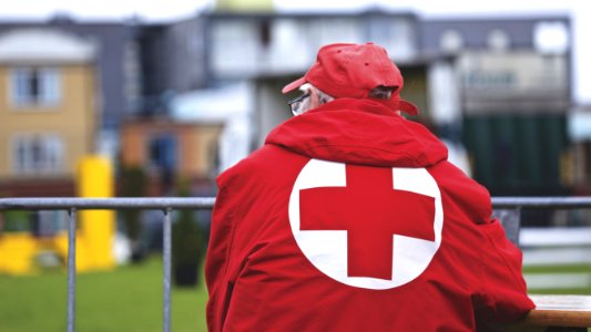 Man In Red Cross Jacket
