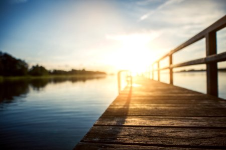 Low Angle Photography Of Brown Wooden Dock At Golden House