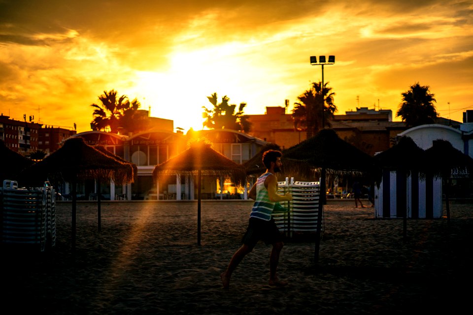 Man Running In The Beach During Sunset