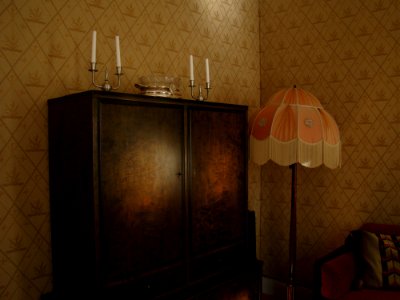 Black Wooden Wardrobe And White And Pink Pedestal Lamp Inside The Room photo