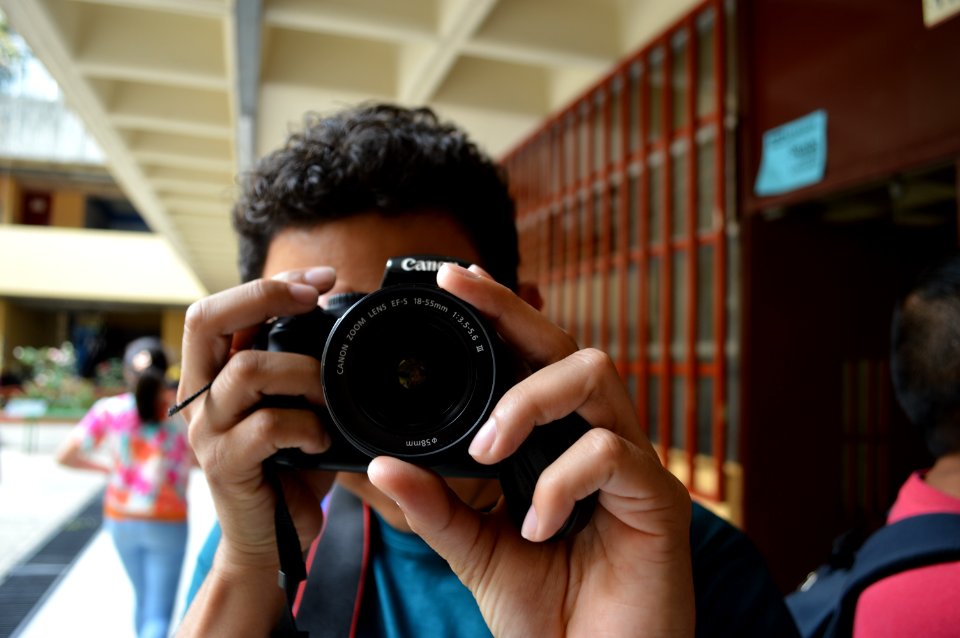 Young Man Taking Picture