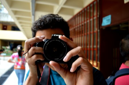 Young Man Taking Picture