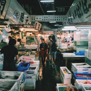 Person Waling On Market In Meat And Fish Section