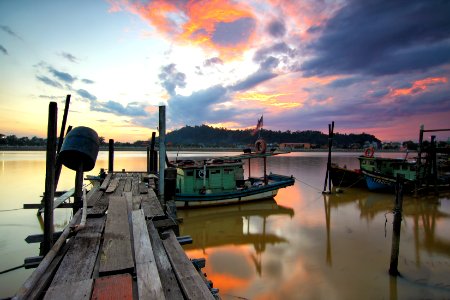 Jetty With Boats At Sunset