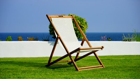 Brown And White Wooden Lounger photo