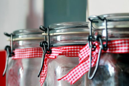 Clear Glass Mason Jar With Red White Ribbon photo