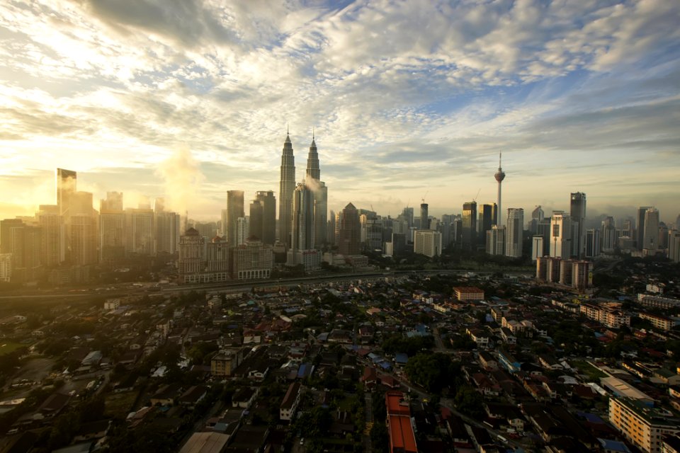 City High Under Cloudy Sky During Daytime