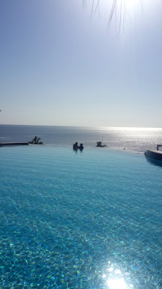 People In Blue Ocean Water During Daytime