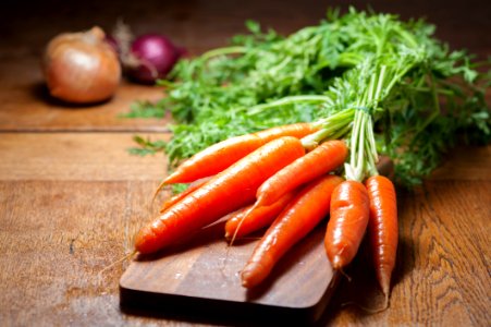 8 Piece Of Carrot On Brown Chopping Board photo