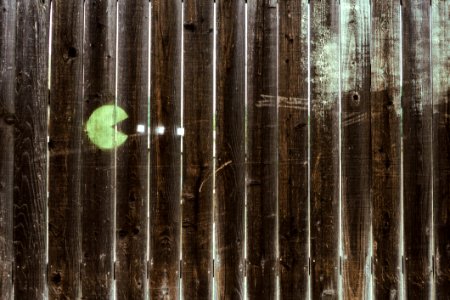 Pacman Drawing On Wooden Fence photo