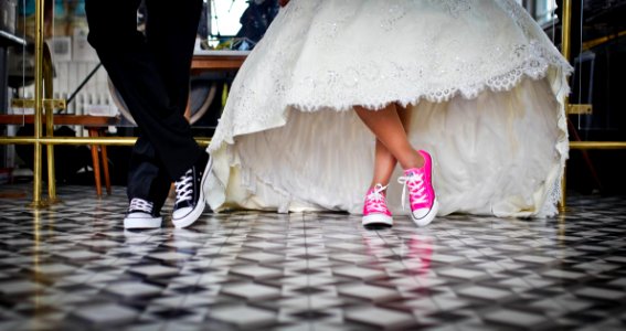 Woman Wearing Pink And White Low Top Shoes Dancing Beside Man photo