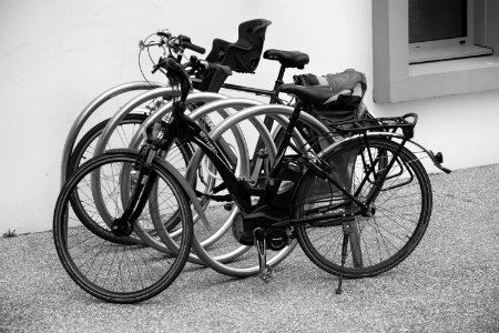 Black And Grey Bicycle Park Beside Wall photo