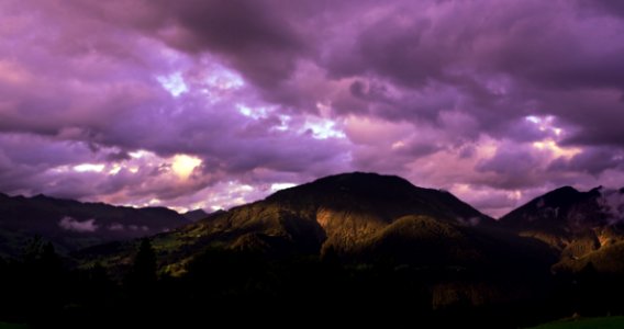 Brown Mountain Under Cloudy Sky During Sunset photo