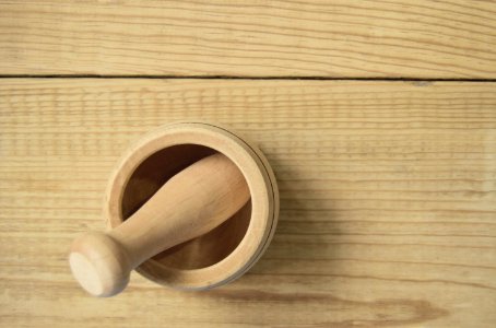 Brown Wooden Pestle And Mortar photo