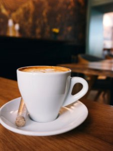 White Ceramic Cup On White Ceramic Saucer With White Espresso Coffe photo