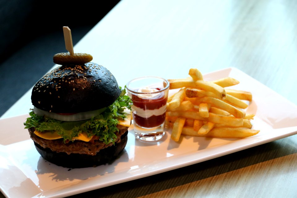 French Fries With Dip On Shot Glass And Black Buns Burger Platter