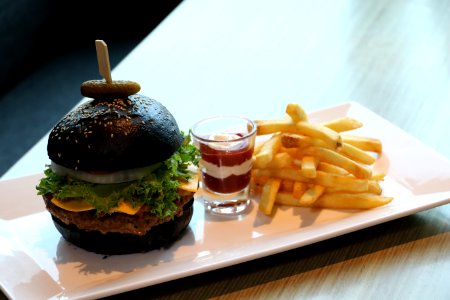 French Fries With Dip On Shot Glass And Black Buns Burger Platter
