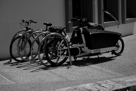 Greyscale Photo Of Utility Bike During Daytime photo