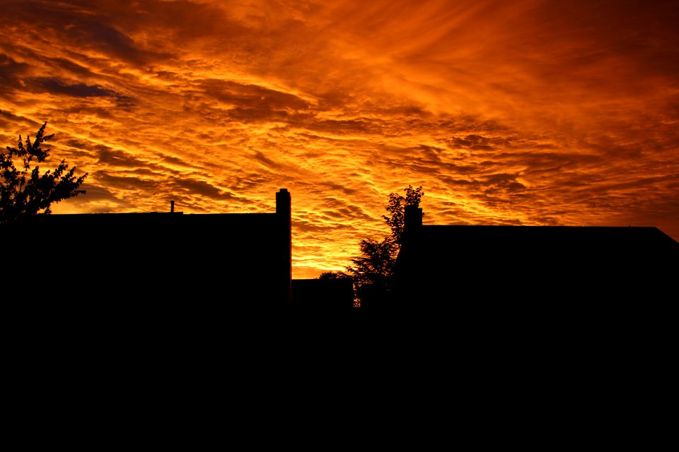 Silhouette Of Buildings Under Orange Sky During Sunset