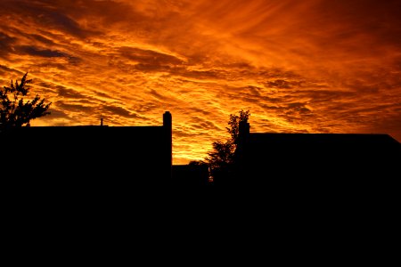 Silhouette Of Buildings Under Orange Sky During Sunset photo