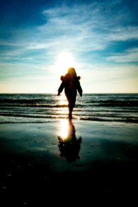 Silhouette Of Child On Beach photo